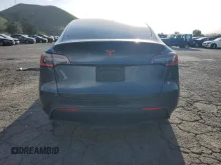 2021 Tesla Model Y Standard Range with VIN 5YJYGDED7MF109418, listed as a Copart auction lot 51590135 with 86,668 mi miles and Salvage Title. Bid and sale history available at DreamBid. Image 6.