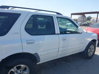 2001 Isuzu Rodeo S with VIN 4S2CK58W614332181, listed as a IAAI auction lot 42585130 with 196,497 mi miles and . Bid and sale history available at DreamBid. Image 13.