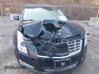 2013 Cadillac XTS Premium z VIN 2G61S5S38D9199459, wystawiony jako IAAI lot #41787638 z przebiegiem 171 298 mil mil oraz . Historia ofert i sprzedaży dostępna na DreamBid. Obrazek 12.