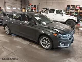 2019 Ford Fusion Energi Titanium with VIN 3FA6P0SUXKR143472, listed as a IAAI auction lot 41712609 with 65,450 mi miles. Bid and sale history available at carsss.com. Image 1.