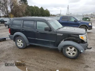 2007 Dodge Nitro SXT z VIN 1D8GU28K07W555205, wystawiony jako Copart lot #81165584 z przebiegiem 206 499 mil mil oraz Szkoda całkowita • Salvage title. Historia ofert i sprzedaży dostępna na DreamBid. Obrazek 4.