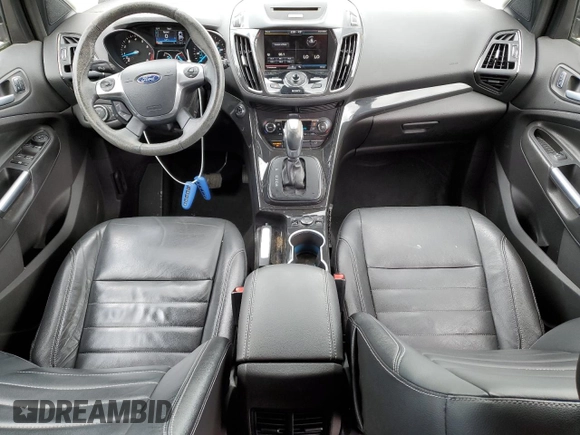 2015 Ford Escape Titanium with VIN 1FMCU0JX5FUA24210, listed as a Copart auction lot 57270855 with 115,613 mi miles and Salvage title. Bid and sale history available at DreamBid. Image 8.