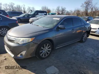 2013 Toyota Camry L with VIN 4T4BF1FK7DR285575, listed as a Copart auction lot 82877124 with 102,946 mi miles and Salvage Title. Bid and sale history available at carsss.com. Image 1.