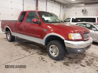 2003 Ford F-150 XL with VIN 1FTRX18L33NB82694, listed as a IAAI auction lot 41612431 with 179,664 mi miles. Bid and sale history available at carsss.com. Image 1.