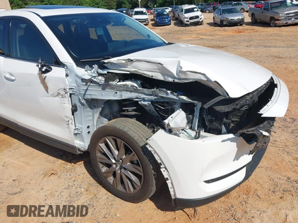 2021 Mazda CX-5 Grand Touring with VIN JM3KFBDM3M0493752, listed as a IAAI auction lot 42456854 with 35,122 mi miles and . Bid and sale history available at DreamBid. Image 6.