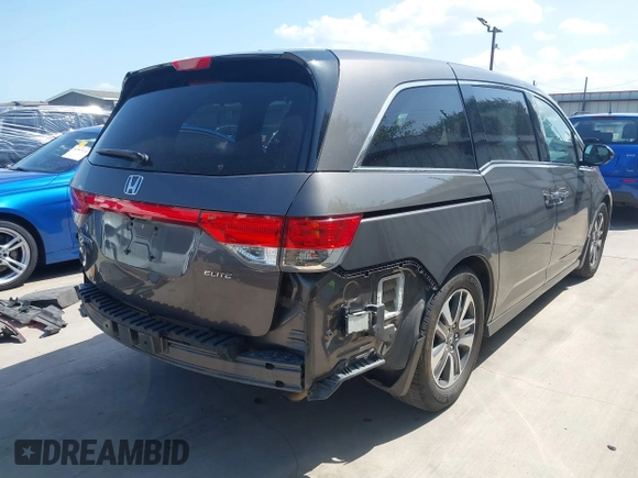 2014 Honda Odyssey Touring with VIN 5FNRL5H99EB075979, listed as a IAAI auction lot 42520154 with 99,314 mi miles and . Bid and sale history available at DreamBid. Image 4.