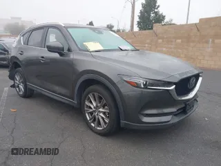 2021 Mazda CX-5 Grand Touring with VIN JM3KFADM2M1340669, listed as a IAAI auction lot 41916687 with 83,872 mi miles. Bid and sale history available at carsss.com. Image 1.