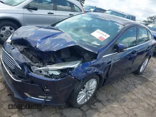 2016 Ford Focus Titanium z VIN 1FADP3J20GL208439, wystawiony jako IAAI lot #42145938 z przebiegiem 135 522 mil mil oraz . Historia ofert i sprzedaży dostępna na DreamBid. Obrazek 2.