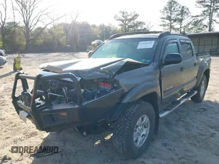 2014 Toyota Tacoma with VIN 3TMLU4EN3EM163162, listed as a IAAI auction lot 41930392 with 167,368 mi miles and . Bid and sale history available at DreamBid. Image 6.