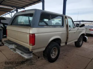 1996 Ford Bronco XL z VIN 1FMEU15N0TLB63427, wystawiony jako Copart lot #82779084 z przebiegiem 175 679 mil mil oraz Szkoda całkowita • Salvage title. Historia ofert i sprzedaży dostępna na DreamBid. Obrazek 3.
