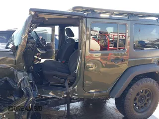 2015 Jeep Wrangler Unlimited Rubicon with VIN 1C4BJWFG0FL623431, listed as a IAAI auction lot 41651317 with 105,508 mi miles. Bid and sale history available at carsss.com. Image 14.