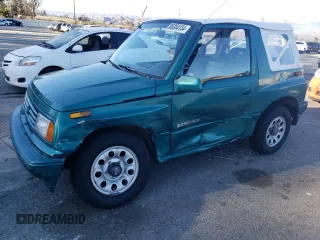 1995 Suzuki Sidekick z VIN 2S3TA02C3S6414337, wystawiony jako Copart lot #86304134 z przebiegiem 104 889 mil mil oraz Szkody całkowita. Historia ofert i sprzedaży dostępna na DreamBid. Obrazek 1.