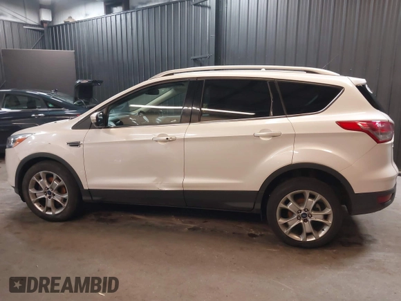 2016 Ford Escape Titanium with VIN 1FMCU9J94GUB02810, listed as a IAAI auction lot 41643907 with 119,684 mi miles. Bid and sale history available at carsss.com. Image 13.