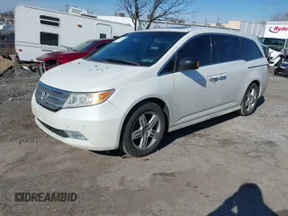 2012 Honda Odyssey Touring with VIN 5FNRL5H96CB010696, listed as a IAAI auction lot 41605868 with 109,411 mi miles and . Bid and sale history available at carsss.com. Image 2.