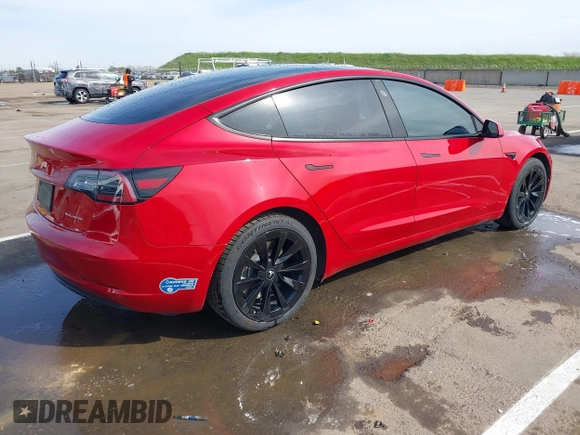 2021 Tesla Model 3 Long Range with VIN 5YJ3E1EB2MF015279, listed as a IAAI auction lot 41765428 with 55,486 mi miles. Bid and sale history available at carsss.com. Image 4.