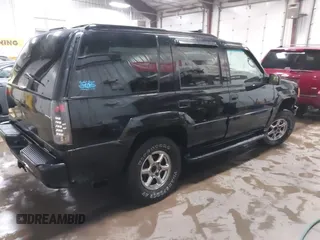 2000 GMC Denali with VIN 1GKEK13R9YR163824, listed as a IAAI auction lot 41245808 with 206,773 mi miles. Bid and sale history available at carsss.com. Image 4.