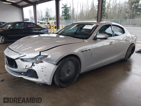 2017 Maserati Ghibli with VIN ZAM57XSLXH1238134, listed as a IAAI auction lot 41871754 with 34,776 mi miles. Bid and sale history available at carsss.com. Image 2.