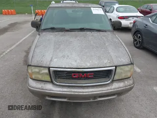 2003 GMC Sonoma SLS z VIN 1GTCS19X838182906, wystawiony jako IAAI lot #41986178 z przebiegiem Nie podano mil oraz . Historia ofert i sprzedaży dostępna na DreamBid. Obrazek 6.