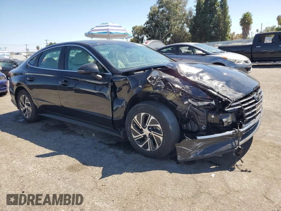 2022 Hyundai Sonata Hybrid Blue with VIN KMHL24JJ9NA041424, listed as a Copart auction lot 70693204 with 32,689 mi miles and Salvage Title. Bid and sale history available at carsss.com. Image 4.