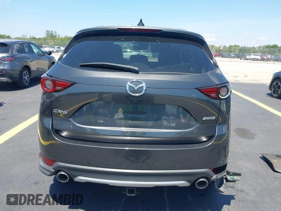 2018 Mazda CX-5 Grand Touring with VIN JM3KFADM8J1310328, listed as a IAAI auction lot 42322780 with 106,378 mi miles and . Bid and sale history available at DreamBid. Image 17.
