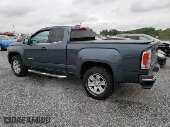 2015 GMC Canyon 2WD SLE with VIN 1GTH5BEA7F1158758, listed as a Copart auction lot 63617524 with 102,744 mi miles and Salvage Title. Bid and sale history available at carsss.com. Image 2.