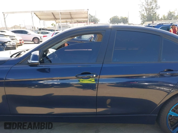 2015 BMW 3 Series 328i with VIN WBA3C1C50FK124300, listed as a IAAI auction lot 40112372 with 142,591 mi miles and . Bid and sale history available at carsss.com. Image 14.
