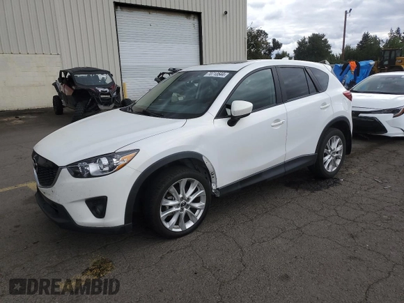 2014 Mazda CX-5 Grand Touring with VIN JM3KE4DY2E0354795, listed as a Copart auction lot 70713544 with 58,848 mi miles and Salvage Title. Bid and sale history available at DreamBid. Image 1.