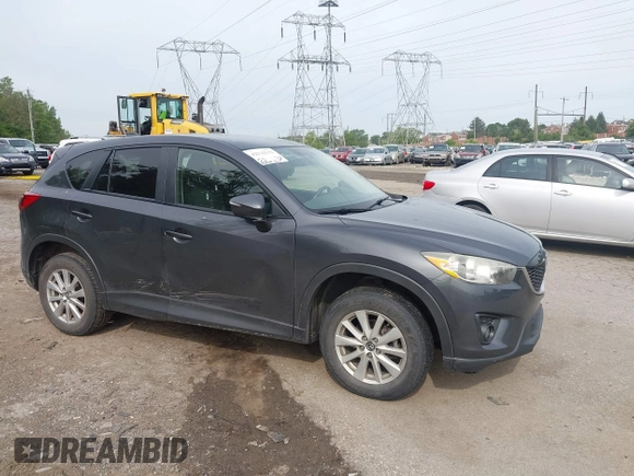 2014 Mazda CX-5 Touring z VIN JM3KE4CY2E0348500, wystawiony jako IAAI lot #42318155 z przebiegiem 182 616 mil mil oraz . Historia ofert i sprzedaży dostępna na DreamBid. Obrazek 6.