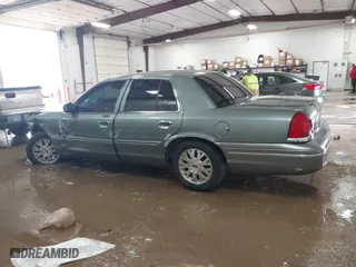 2005 Ford Crown Victoria LX with VIN 2FAFP74W05X124670, listed as a IAAI auction lot 41581963 with 135,486 mi miles. Bid and sale history available at carsss.com. Image 14.