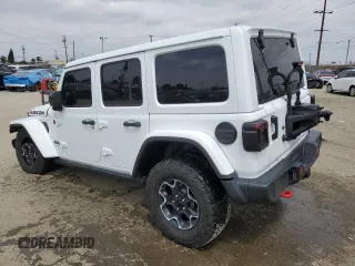 2023 Jeep Wrangler Rubicon with VIN 1C4HJXFG3PW691724, listed as a Copart auction lot 50985745 with 32,377 mi miles and Salvage title. Bid and sale history available at DreamBid. Image 2.