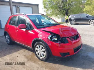 2010 Suzuki SX4 with VIN JS2YB5A34A6301801, listed as a IAAI auction lot 41884838 with 124,381 mi miles. Bid and sale history available at carsss.com. Image 1.