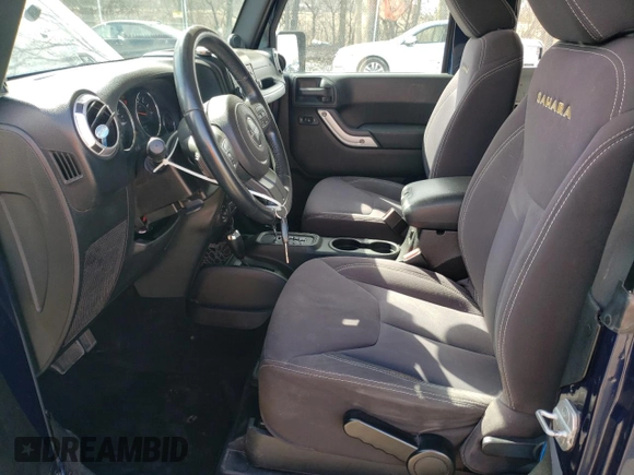2013 Jeep Wrangler Sahara with VIN 1C4AJWBG3DL516842, listed as a Copart auction lot 49246065 with 129,594 mi miles and Salvage title. Bid and sale history available at DreamBid. Image 7.