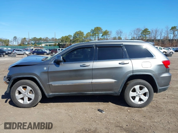 2012 Jeep Grand Cherokee Laredo with VIN 1C4RJFAG0CC145061, listed as a IAAI auction lot 41820140 with 185,015 mi miles. Bid and sale history available at carsss.com. Image 14.