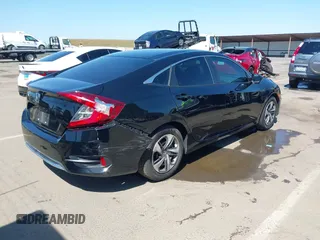 2019 Honda Civic Sedan LX with VIN 19XFC2F61KE202252, listed as a IAAI auction lot 42139362 with 37,128 mi miles. Bid and sale history available at carsss.com. Image 4.