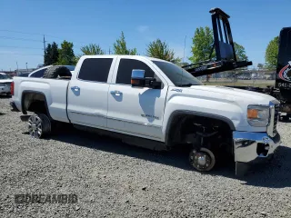 2015 GMC Sierra 2500HD SLT with VIN 1GT12ZE83FF121256, listed as a Copart auction lot 53985215 with 241,326 mi miles and Salvage title. Bid and sale history available at DreamBid. Image 4.