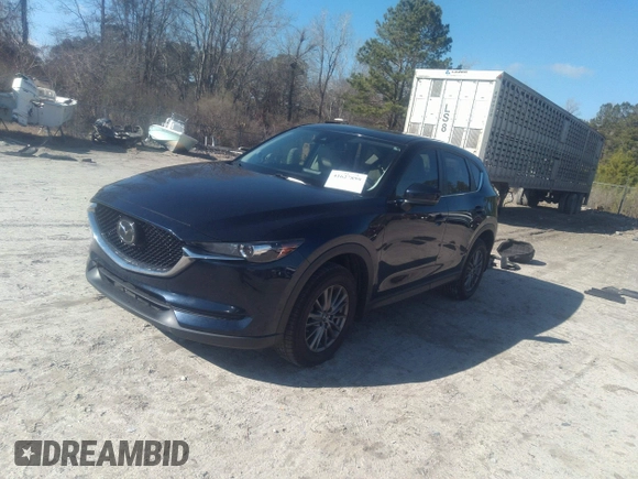 2020 Mazda CX-5 Touring with VIN JM3KFACM1L1817303, listed as a IAAI auction lot 41627859 with 57,268 mi miles. Bid and sale history available at carsss.com. Image 17.