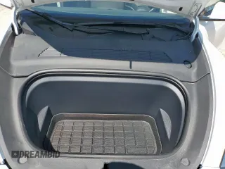 2023 Tesla Model Y Long Range z VIN 7SAYGDEE1PA155629, wystawiony jako Copart lot #52234735 z przebiegiem 24 944 mil mil oraz Szkoda całkowita • Salvage title. Historia ofert i sprzedaży dostępna na DreamBid. Obrazek 14.