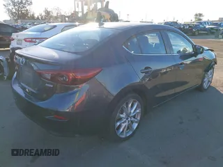 2014 Mazda 3 S Grand Touring with VIN JM1BM1W36E1112033, listed as a IAAI auction lot 41412655 with 115,050 mi miles and . Bid and sale history available at DreamBid. Image 4.