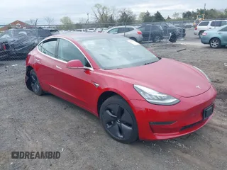 2018 Tesla Model 3 Long Range Battery with VIN 5YJ3E1EA8JF030677, listed as a IAAI auction lot 41989347 with 69,674 mi miles. Bid and sale history available at carsss.com. Image 1.