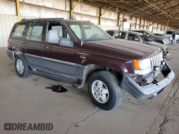 1995 Jeep Grand Cherokee Laredo with VIN 1J4GZ58S1SC704775, listed as a Copart auction lot 87556535 with 266,365 mi miles and Salvage title. Bid and sale history available at DreamBid. Image 4.