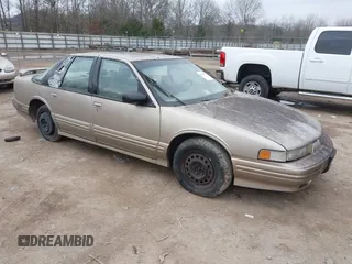 1996 Oldsmobile Cutlass Supreme S z VIN 1G3WH52M9TF377685, wystawiony jako IAAI lot #41496775 z przebiegiem 197 366 mil mil oraz . Historia ofert i sprzedaży dostępna na DreamBid. Obrazek 1.