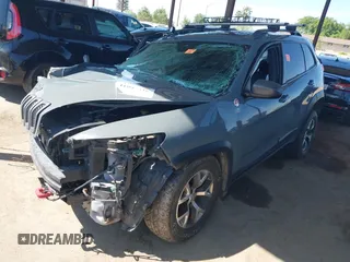 2014 Jeep Cherokee Trailhawk with VIN 1C4PJMBS5EW134900, listed as a IAAI auction lot 41997316 with 96,445 mi miles. Bid and sale history available at carsss.com. Image 2.