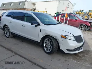 2015 Lincoln MKT EcoBoost with VIN 2LMHJ5AT1FBL03575, listed as a IAAI auction lot 41456665 with 74,544 mi miles and . Bid and sale history available at DreamBid. Image 1.