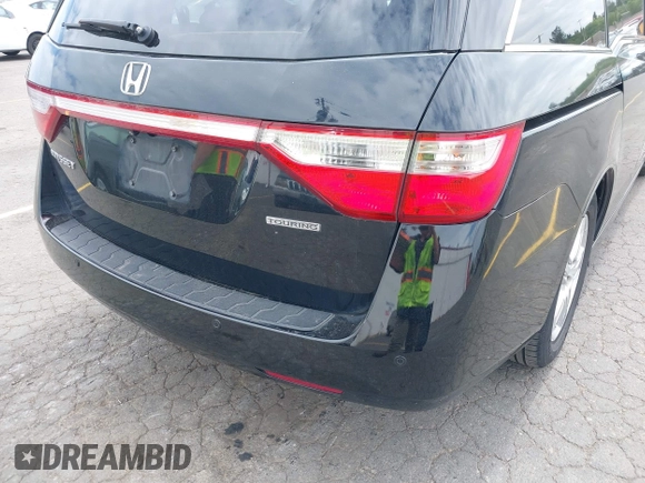 2012 Honda Odyssey Touring with VIN 5FNRL5H93CB121190, listed as a IAAI auction lot 42223998 with 154,358 mi miles and . Bid and sale history available at DreamBid. Image 6.