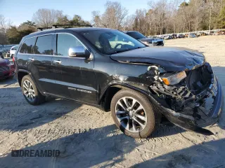2017 Jeep Grand Cherokee Overland with VIN 1C4RJFCT5HC828780, listed as a Copart auction lot 46874965 with 90,269 mi miles and Salvage Title. Bid and sale history available at carsss.com. Image 4.
