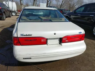 1996 Ford Thunderbird LX z VIN 1FALP6240TH131517, wystawiony jako IAAI lot #41811552 z przebiegiem 87 493 mil mil oraz . Historia ofert i sprzedaży dostępna na DreamBid. Obrazek 16.