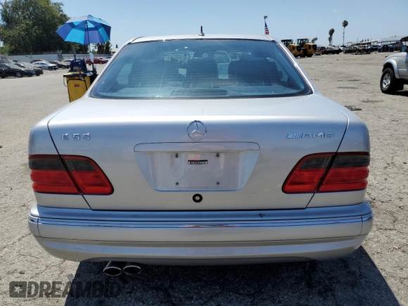 2000 Mercedes-Benz E with VIN WDBJF74J7YB055624, listed as a Copart auction lot 63880184 with 71,355 mi miles and Salvage Title. Bid and sale history available at DreamBid. Image 6.