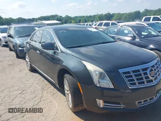 2013 Cadillac XTS Luxury z VIN 2G61P5S37D9110658, wystawiony jako IAAI lot #42196442 z przebiegiem 182 228 mil mil oraz . Historia ofert i sprzedaży dostępna na DreamBid. Obrazek 1.