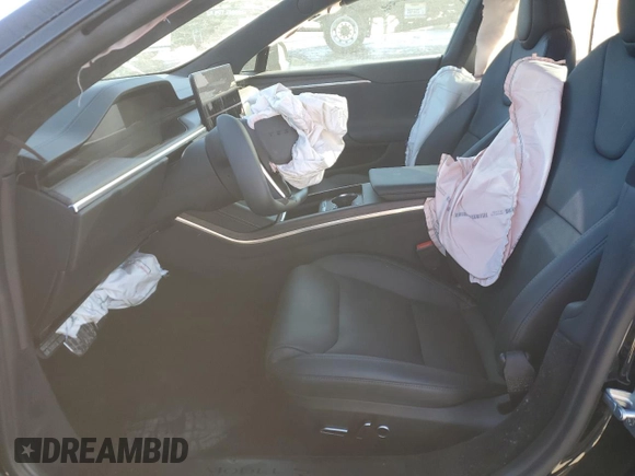 2023 Tesla Model S with VIN 5YJSA1E5XPF519570, listed as a Copart auction lot 80573863 with Not provided miles and Salvage title. Bid and sale history available at DreamBid. Image 7.
