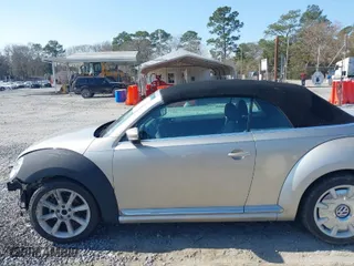 2013 Volkswagen Beetle Convertible 2.5L with VIN 3VW5X7AT9DM816045, listed as a IAAI auction lot 41488594 with 51,572 mi miles. Bid and sale history available at carsss.com. Image 15.